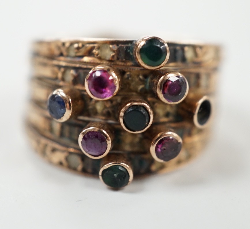 A yellow metal, quintuple band and multi gem set ring (stone missing), size H, gross weight 4.5 grams.